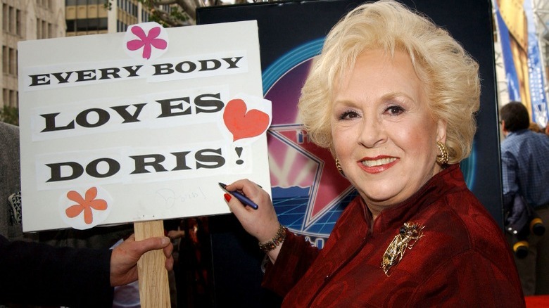 Doris Roberts signing an autograph