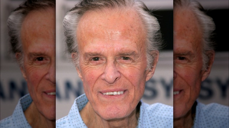 Robert Culp smiling on a red carpet