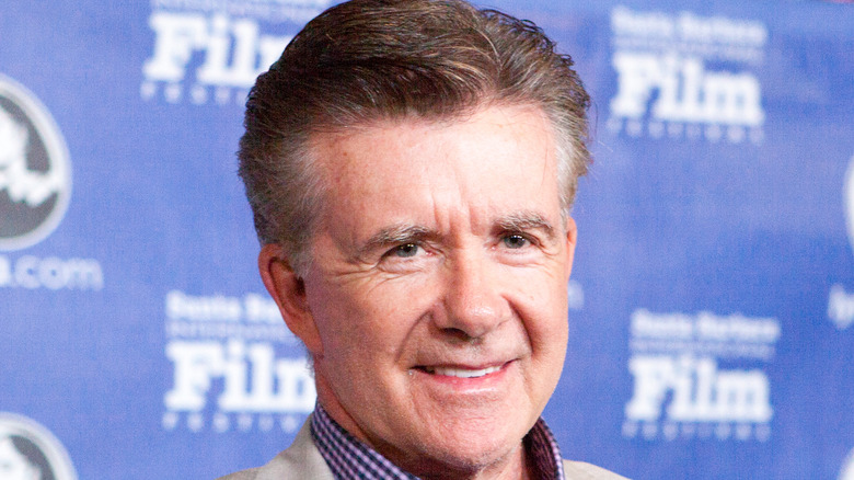 Alan Thicke smiling on the red carpet