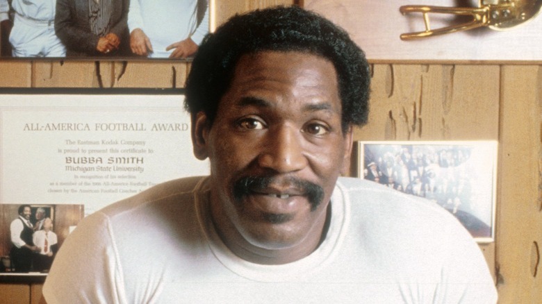 Bubba Smith leaning and posing