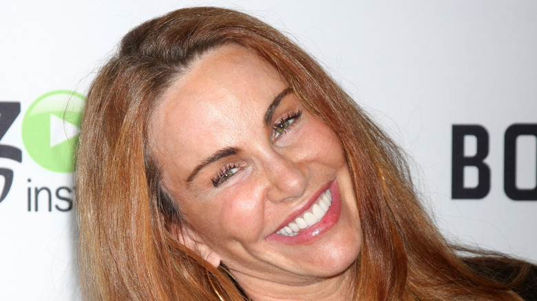 Tawny Kitaen leaning