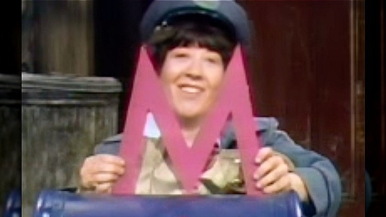 Molly the Mail Lady with letter M