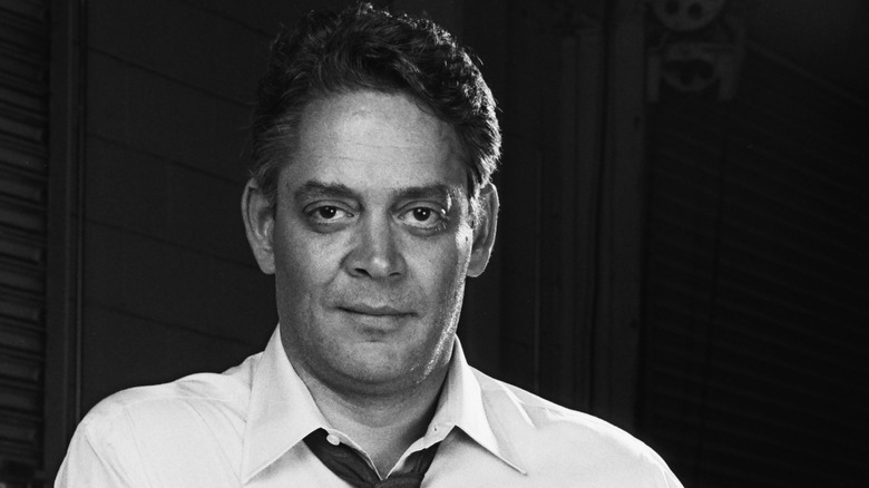 Raul Julia looking at camera