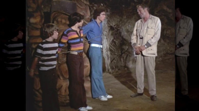 Vincent Price standing in cave