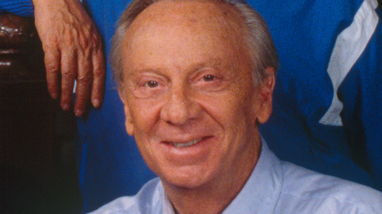 Norman Fell wearing a light blue shirt