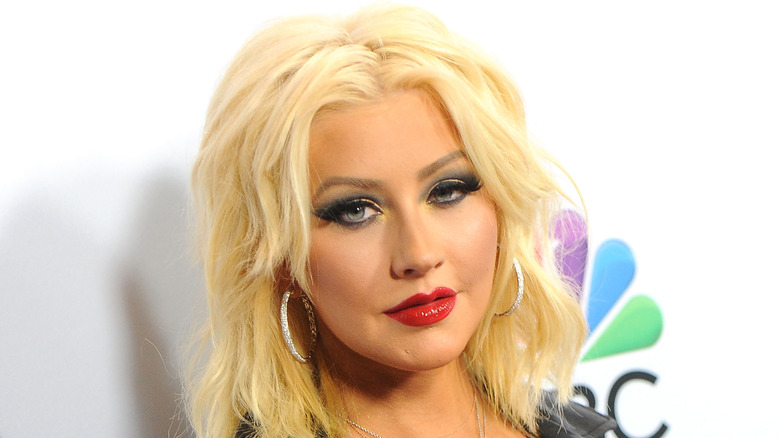 Christina Aguilera giving smoldering look with white background
