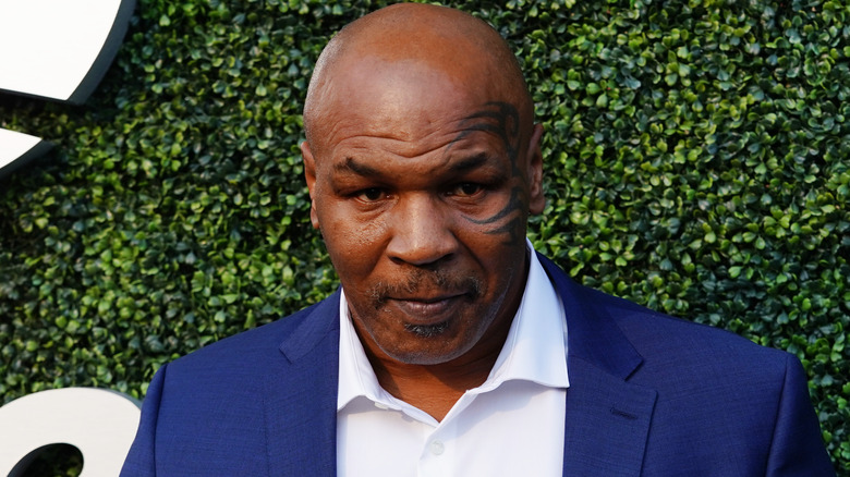 Mike Tyson looks on