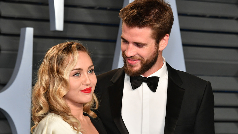 Miley Cyrus, Liam Hemsworth smiling