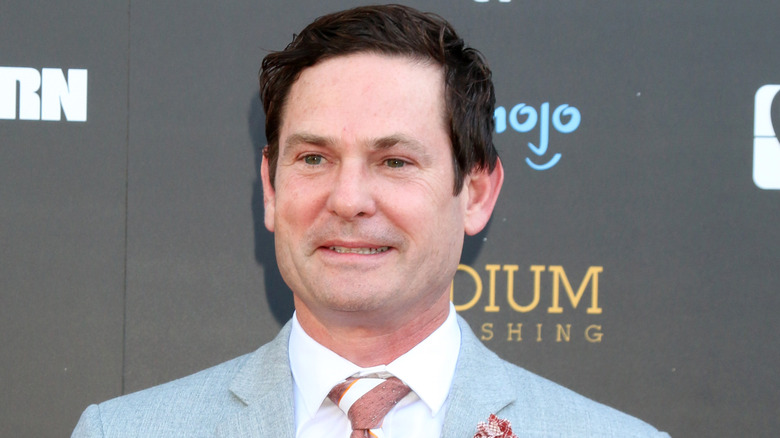 Henry Thomas smiles