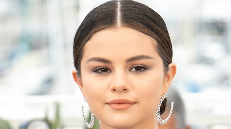 Selena Gomez wearing silver hoop earrings