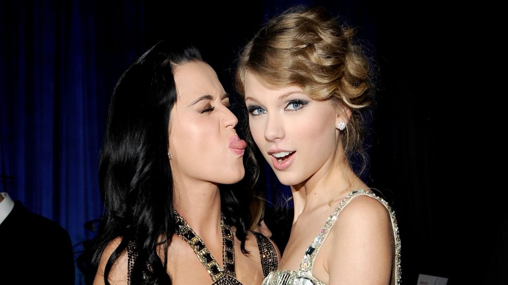 Katy Perry playfully sticking her tongue out at Taylor Swift