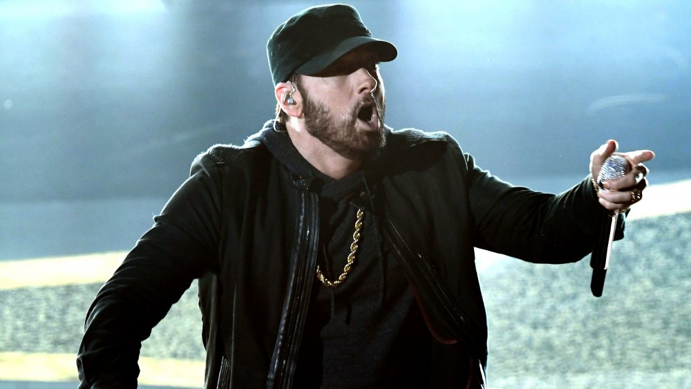 Eminem, mouth agog, on stage