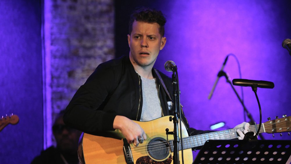 Anderson East with guitar on stage