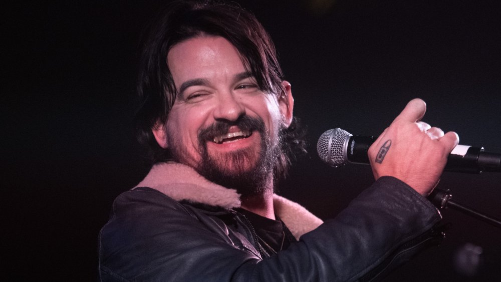 Shooter Jennings laughing on stage