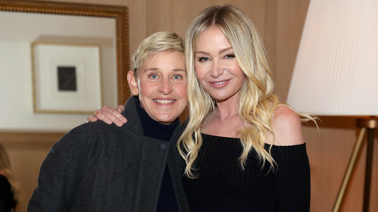 Ellen DeGeneres posing with Portia de Rossi