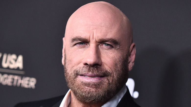 John Travolta sporting a bald head