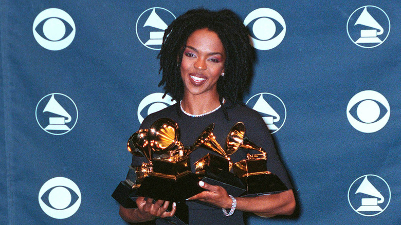 Lauryn Hill holding Grammy Awards