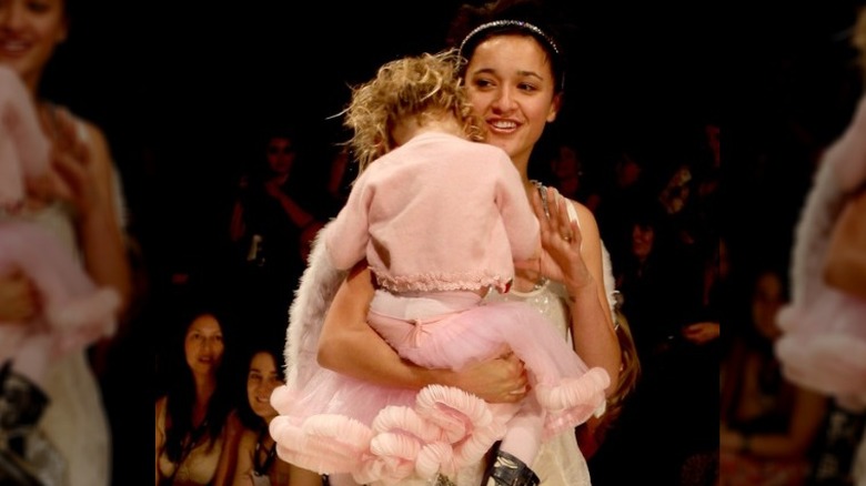 Keisha Castle-Hughes holding daughter Felicity