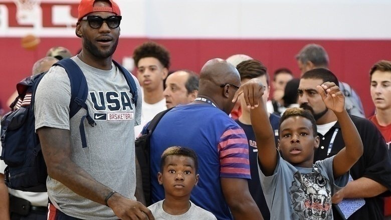 LeBron James, LeBron James Jr., and Bryce Maximus James at an event