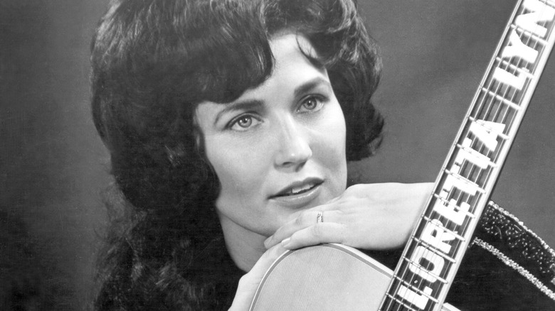 Loretta Lynn with a guitar