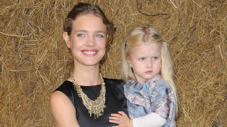 Natalia Vodianova holding daughter Neva