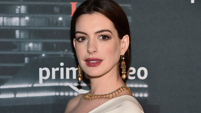 Anne Hathaway smiling at event