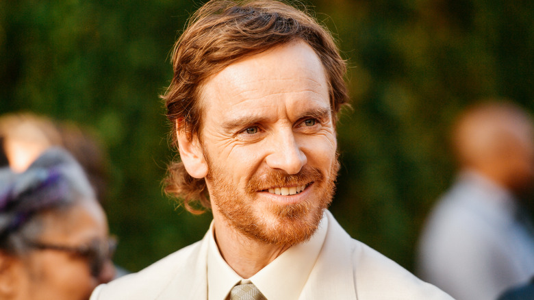 Michael Fassbender smiling at event