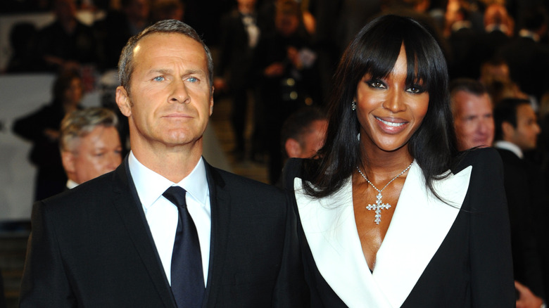 Vladislav Doronin frowns, Naomi Campbell smiles