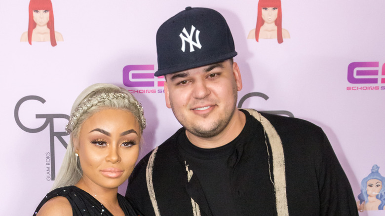 Blac Chyna and Rob Kardashian look at cameras