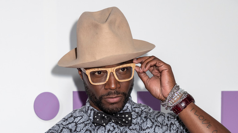 Taye Diggs fixing his glasses