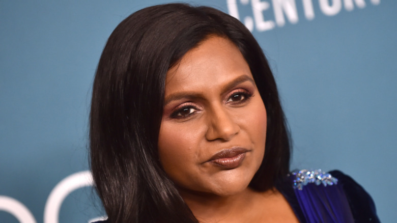 Mindy Kaling with a serious expression