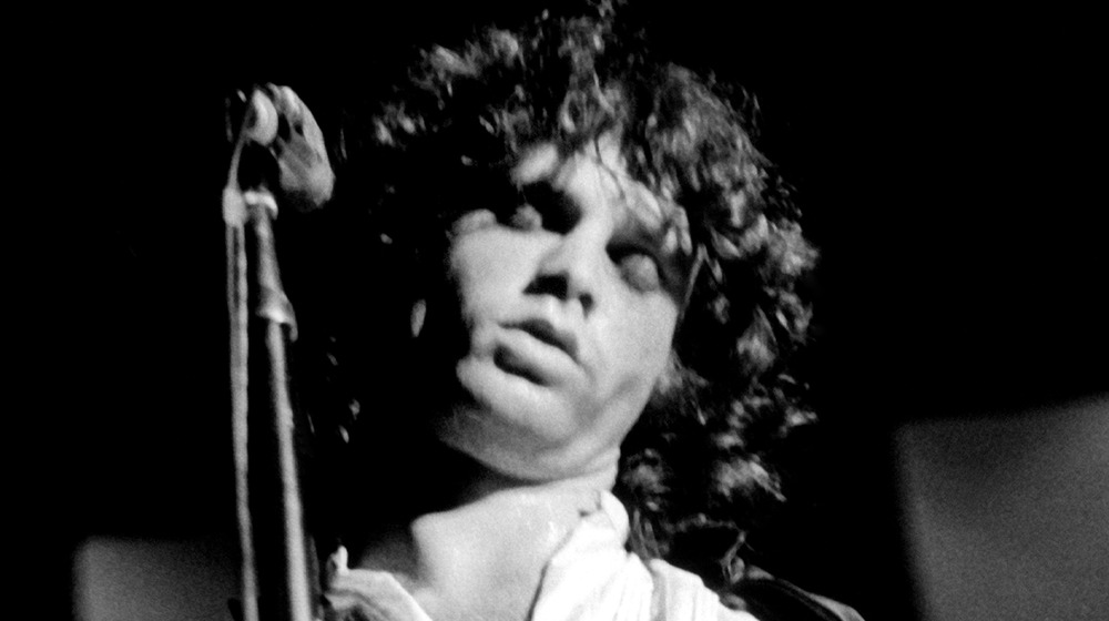 Jim Morrison eyes closed on stage