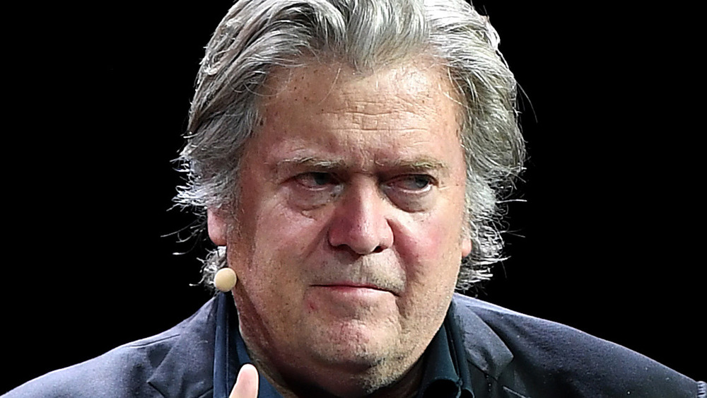 Steve Bannon, shifty-eyed, on stage