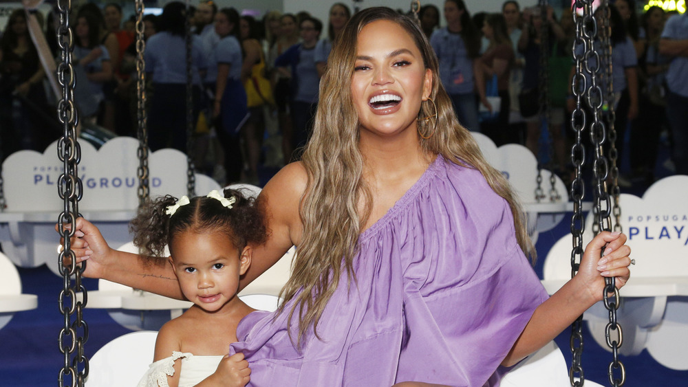 Chrissy Teigen with daughter Luna