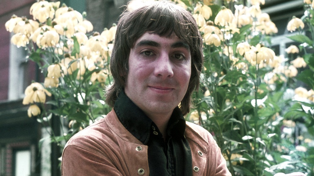 Keith Moon in front of flowers
