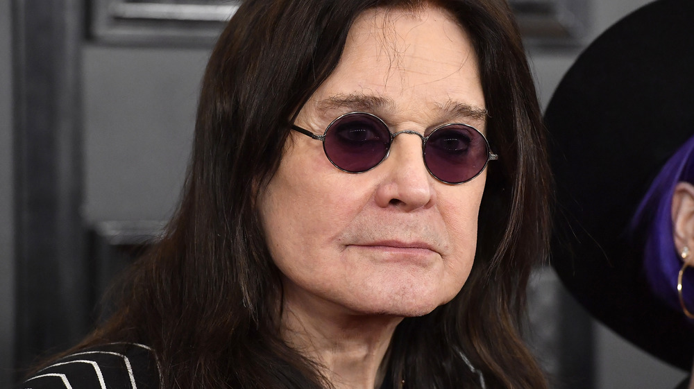 Ozzy Osbourne wearing purple glasses