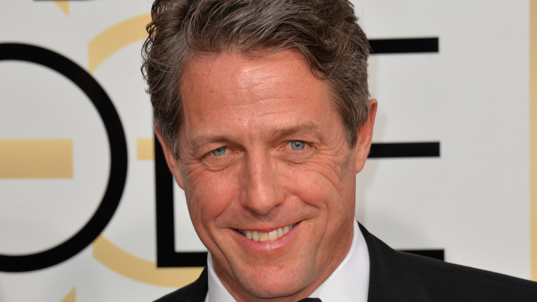 Hugh Grant grinning