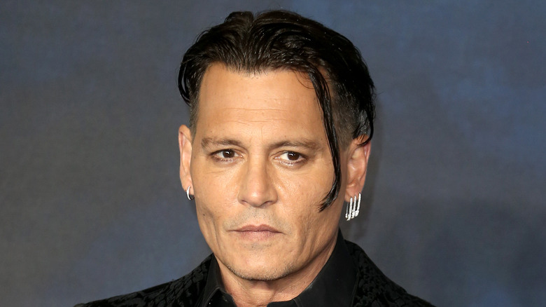 Johnny Depp clean shaven on red carpet