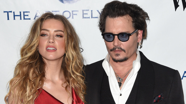 Amber Heard and Johnny Depp posing