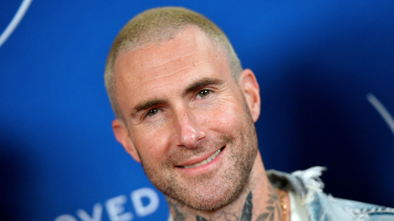 Adam Levine, smiling