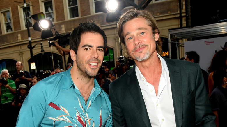 Eli Roth and Brad Pitt smiling