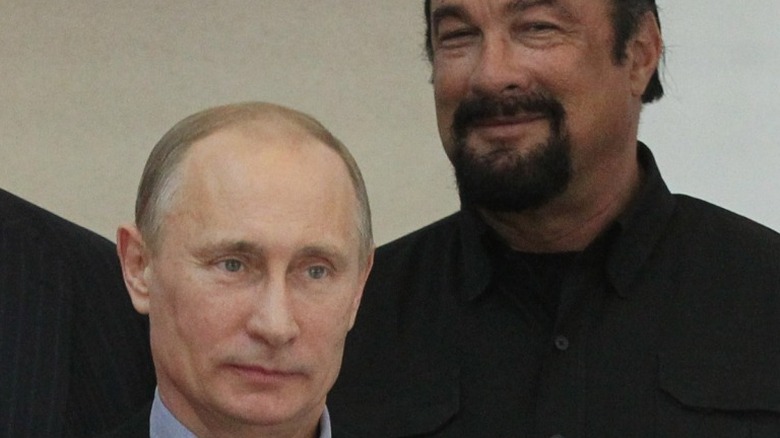 Steven Seagal smiling next to Vladimir Putin