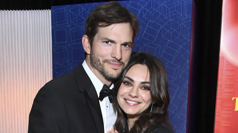 Mila Kunis and Ashton Kutcher smiling