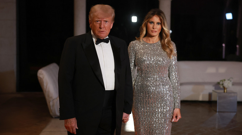 Donald and Melania Trump holding hands