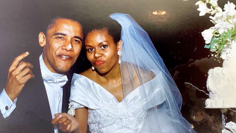 The Obamas eating wedding cake