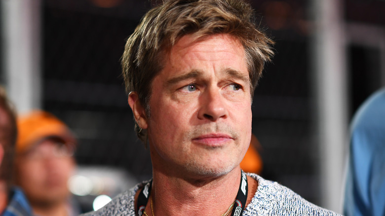 Brad Pitt looks to the side