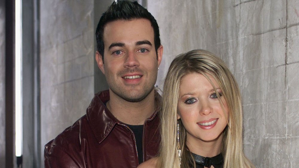 Carson Daly and Tara Reid smiling at camera