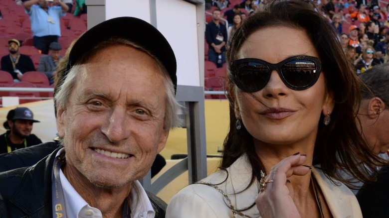 Michael Douglas and Catherine Zeta-Jones at a game