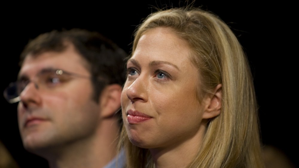 Marc Mezvinsky and Chelsea Clinton looking up