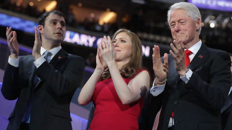 Marc Mezvinsky, Chelsea Clinton, and Bill Clinton clapping